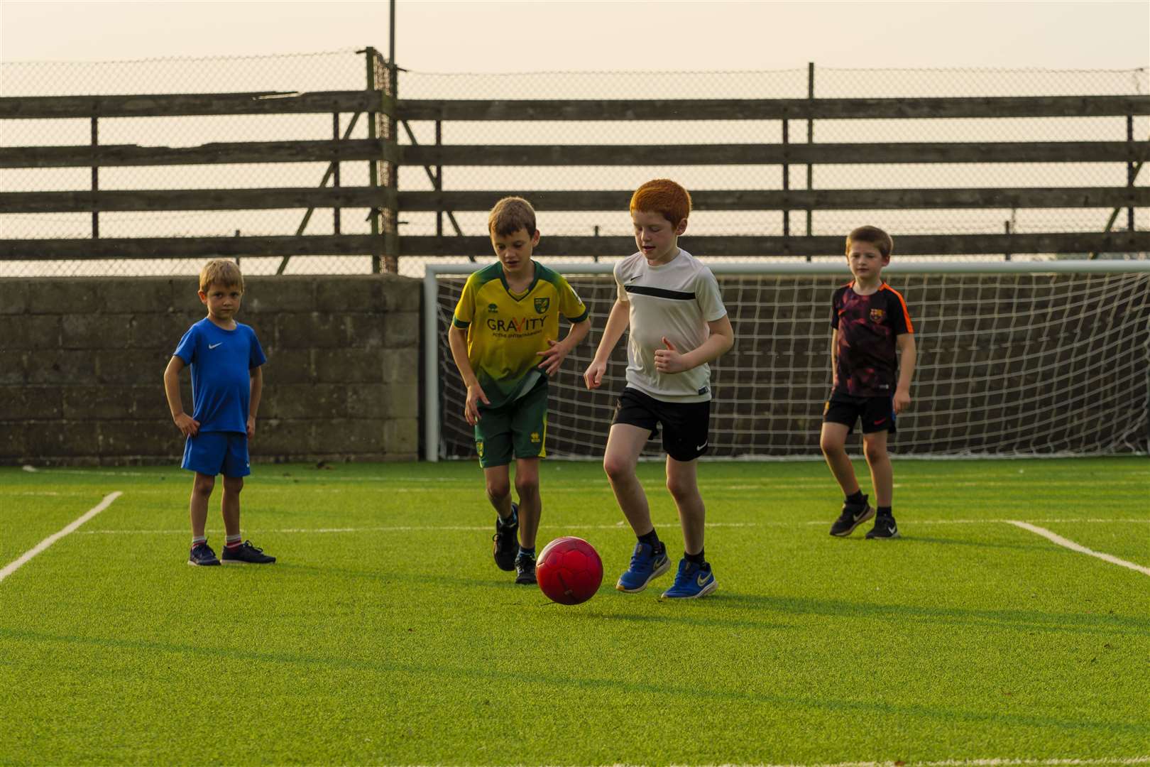 Youngsters in Carleton Rode enjoying their new playing surface. Picture: Mark Bullimore Photography 2021.