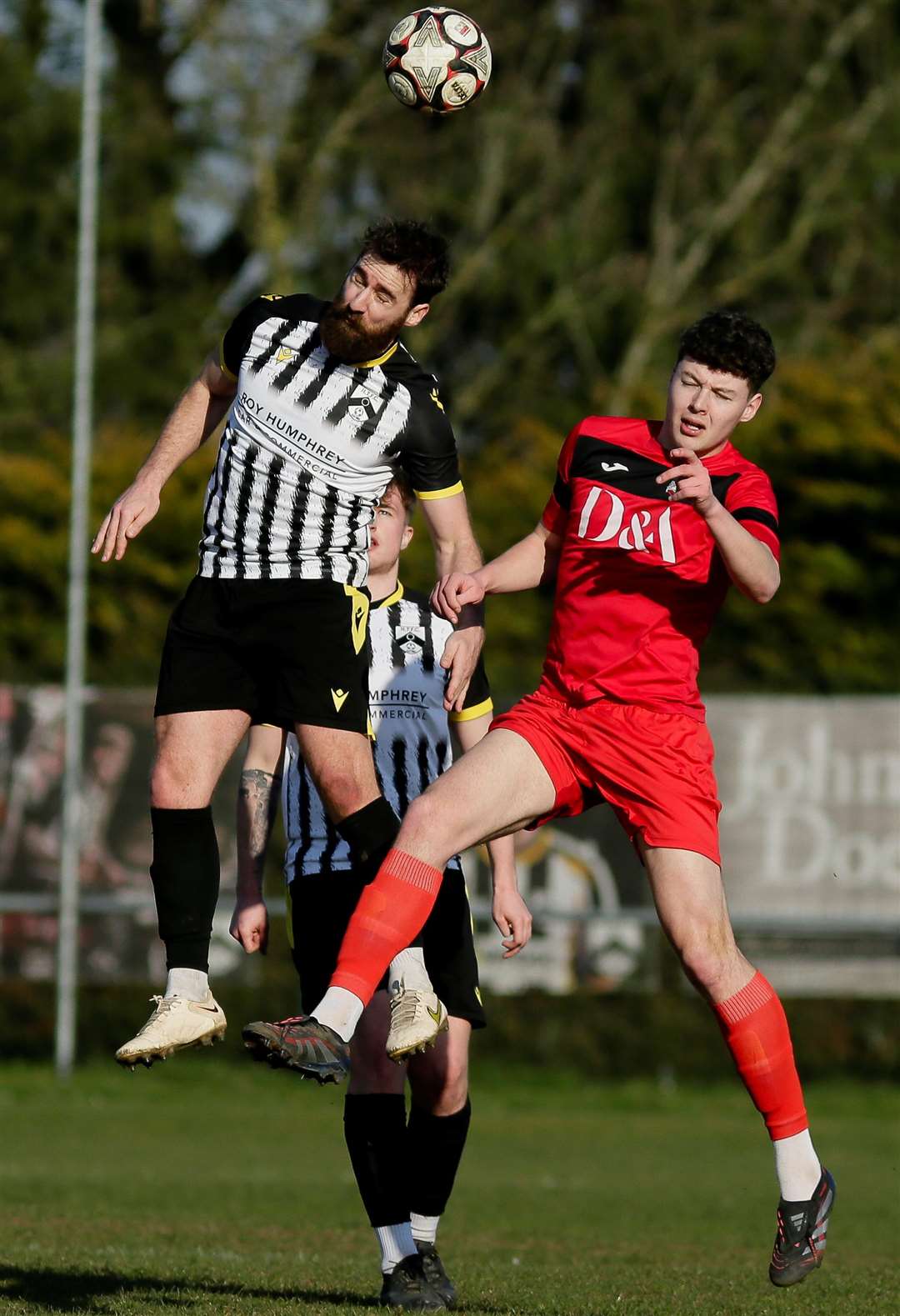 Nathan Page wins an aerial challenge during his 200th appearance for Harleston Town in early March Picture: Mark Bullimore