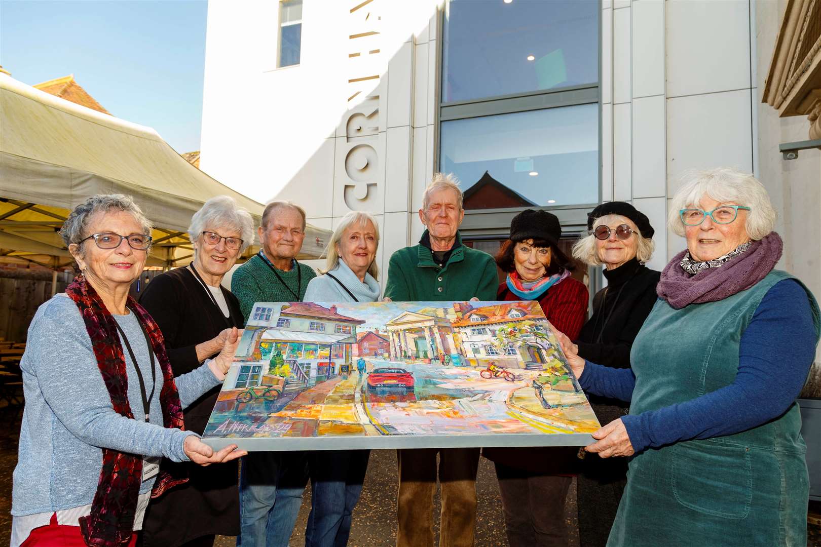 Suzanne Kayne (left) and Jean Grocott (right) display the artwork with some of the other volunteers. Picture: Mark Bullimore
