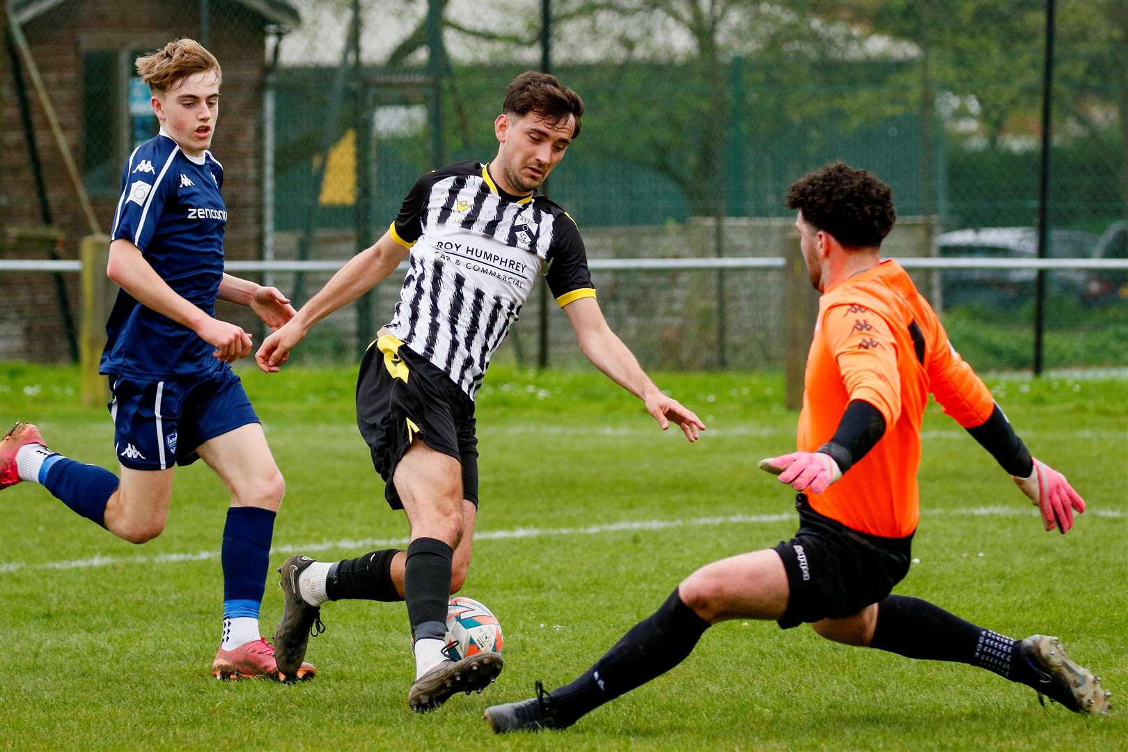 Rob Turner rounds the goalkeeper on his way to scoring against Brantham on Saturday Picture: Mark Bullimore