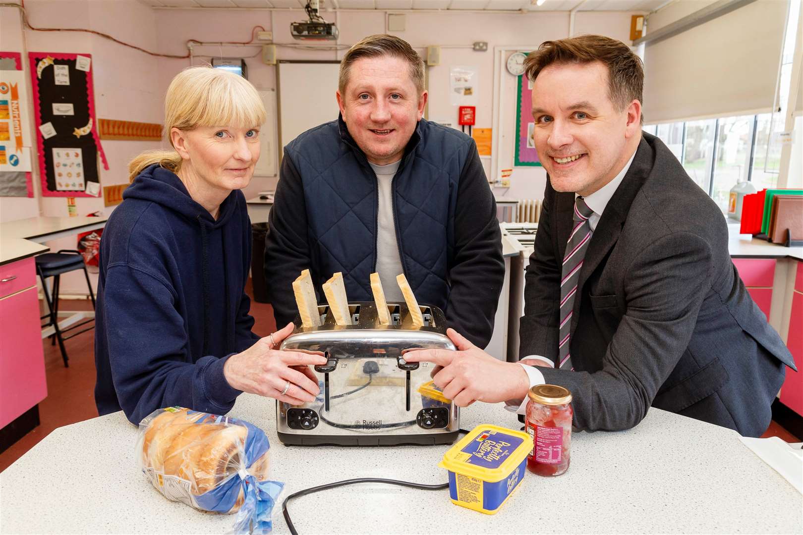 Stefan Dente, centre, with breakfast club co-ordinator Karen O’Neill and headteacher Sam Stopps. Picture: Mark Bullimore